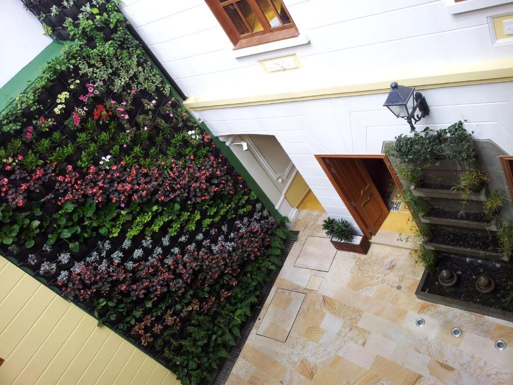 Hotel Santa Lucia Boutique Spa Bogota Exterior photo A green wall in a courtyard